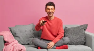 Relaxed guy using remote control